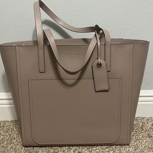Kate Spade large pocket tote in muted taup. Never worn & has original tags.